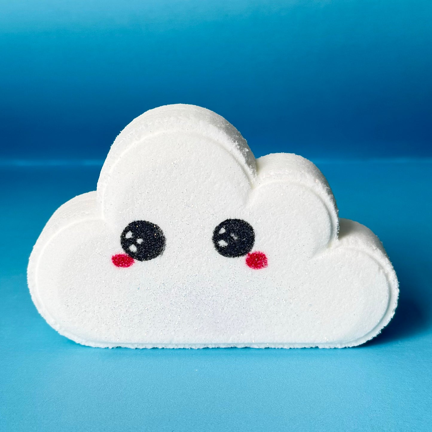 Cloud shaped bath bomb, with cute eyes and rosey cheeks, hand painted on face. 